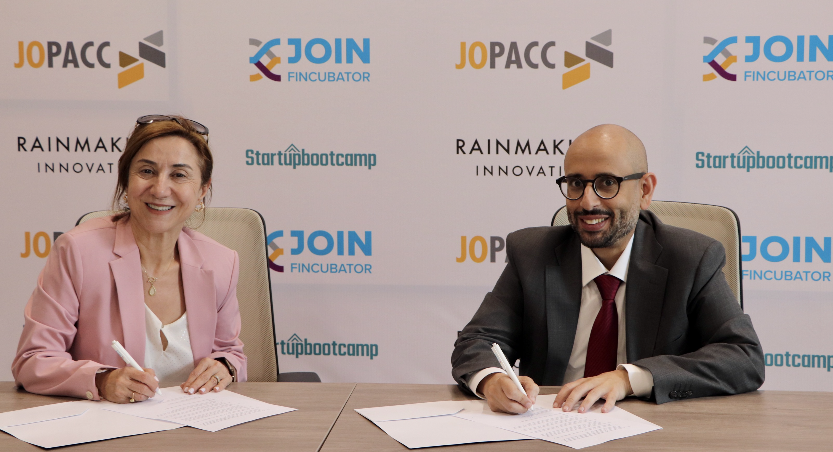CEO of JoPACC Maha Bahou and CEO of Rainmaking Innovation MENA Ibrahim Seksek during a signing ceremony (Photo courtesy of JoPACC)